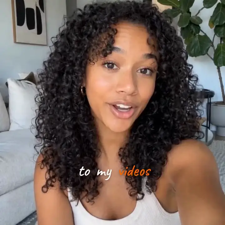 A vlogger talking to camera with the handwritten caption to my videos